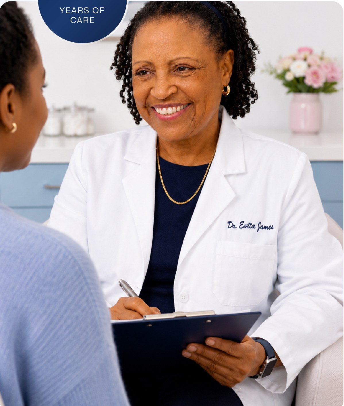 Dr. James taking notes with a patient